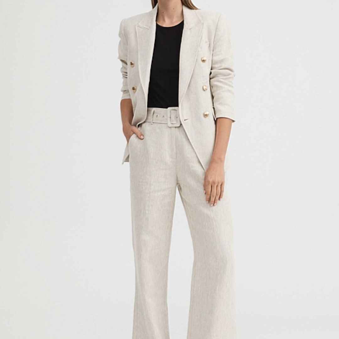 Women in yarn dyed linen single breasted jacket and wide leg pant with black top